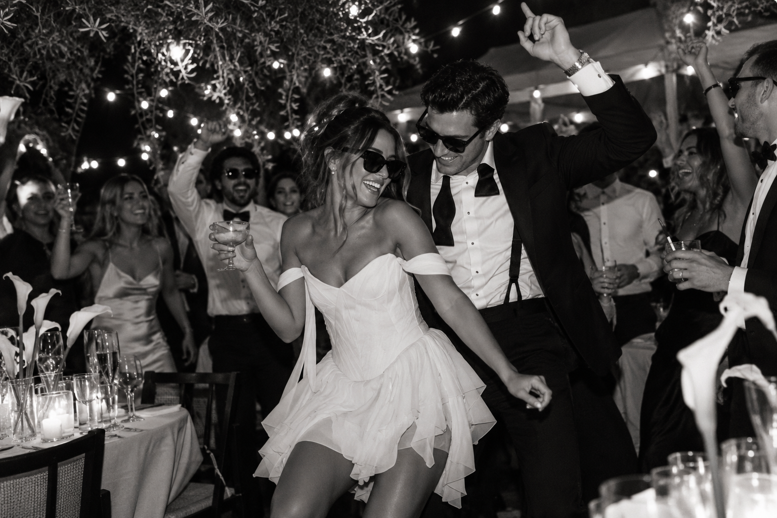 Black-and-white wedding afterparty with a couple in sunglasses